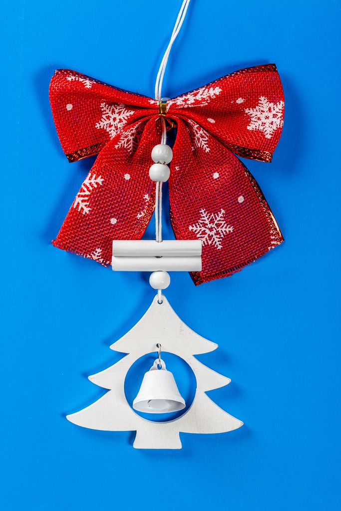 New year decorations for the Christmas tree with bell on blue