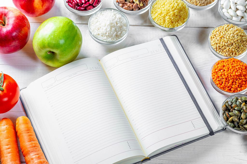 Notebook with a large selection of ingredients for cooking
