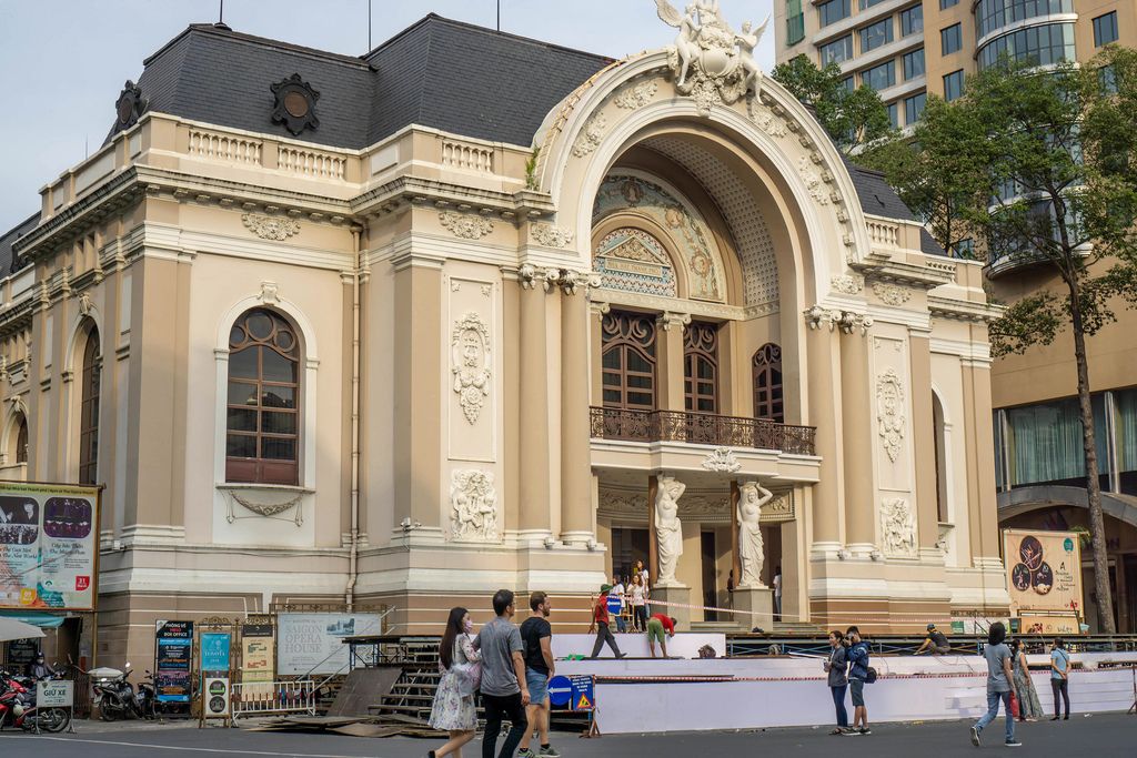 Opera House in Ho Chi Minh City with Tourists walking by