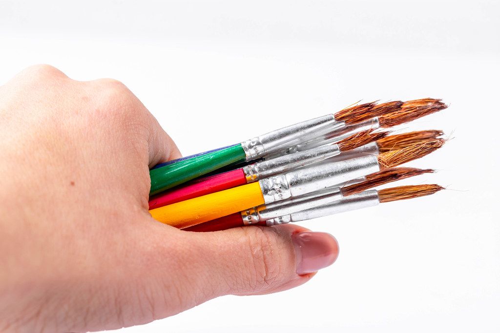 Paint brushes in a woman's hand (Flip 2019)