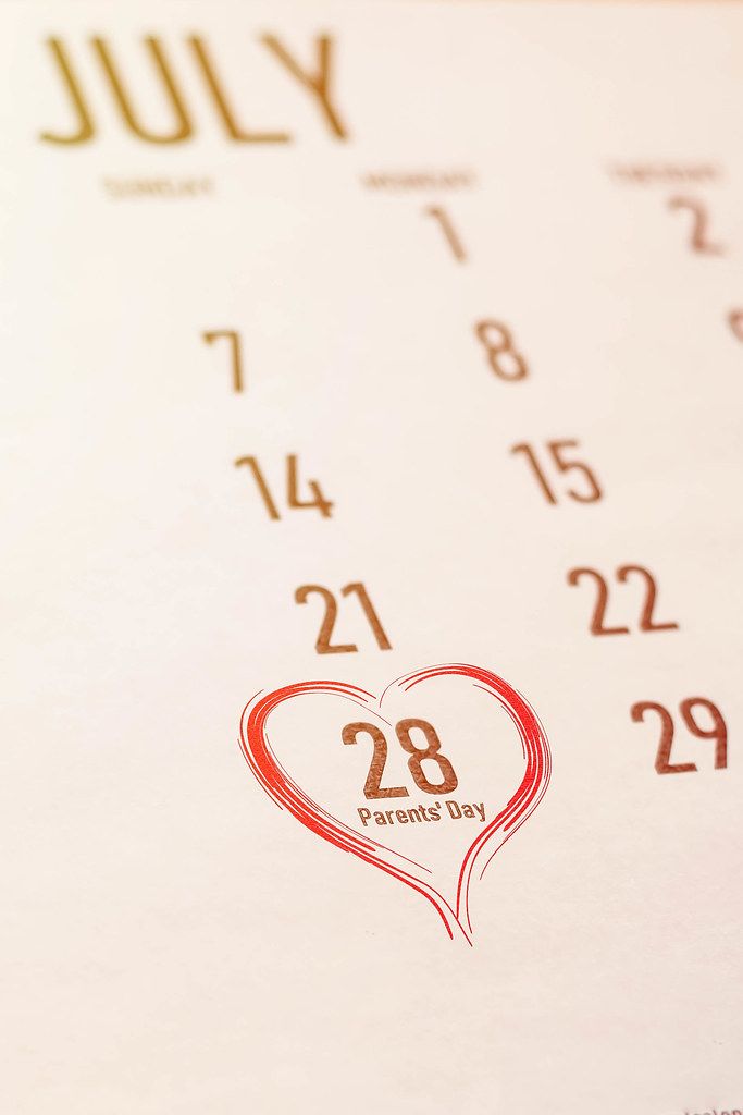 Parent's day concept. Image of July 28 selected with heart sign on the calendar