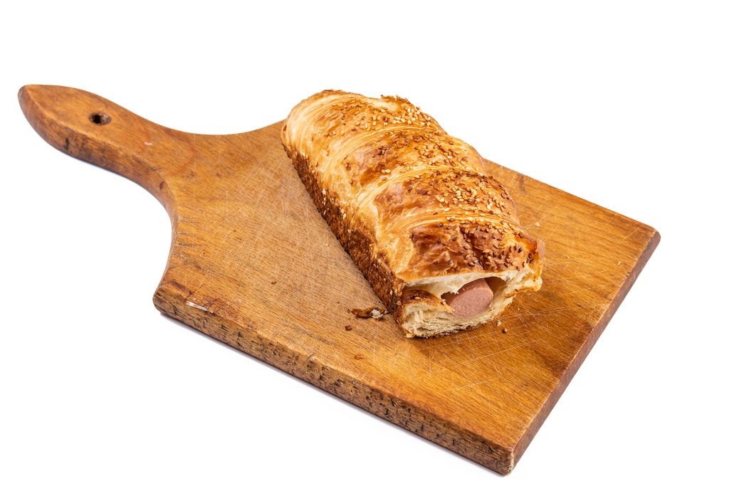 Pastry with Hot Dog on the wooden board