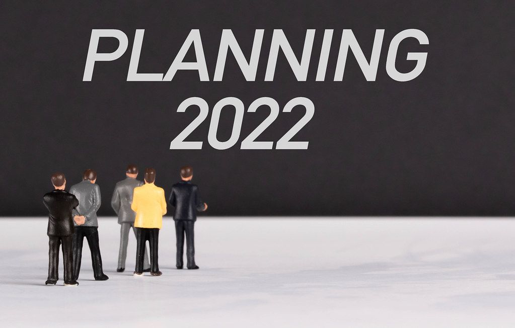 People standing in front of Planning 2022 text
