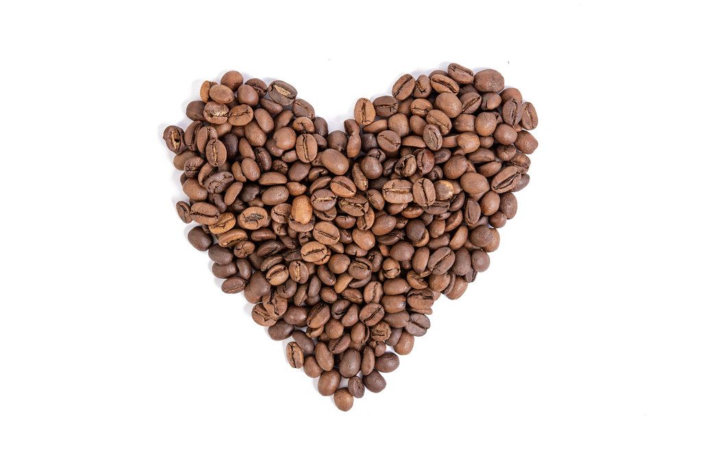 Raw Coffee Heart shape above white background