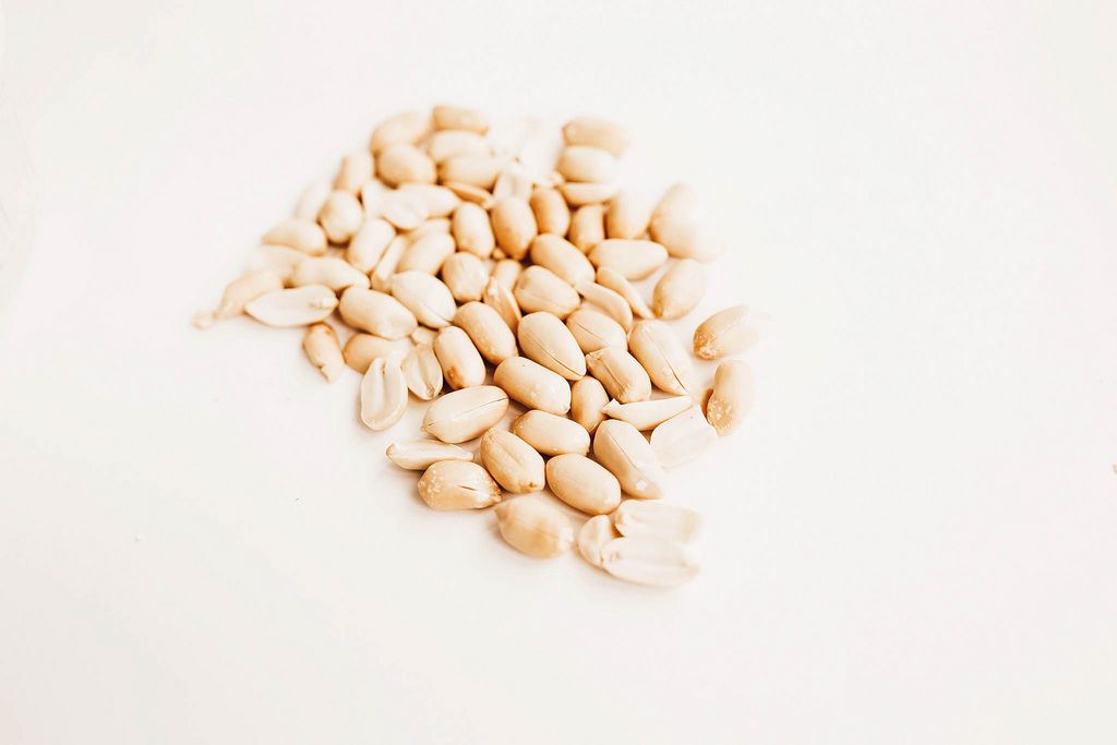 Raw peanuts on white background isolated