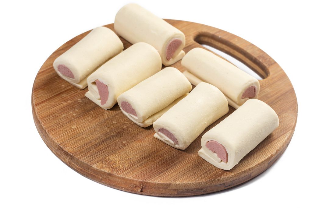 Raw Roll buns with Hot Dog on the wooden board