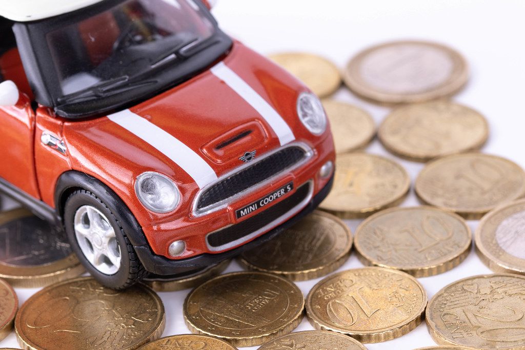 Red car driving on coins