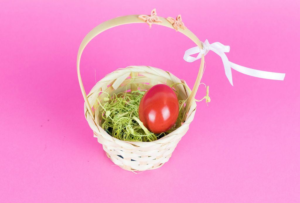 Red Easter egg in a basket