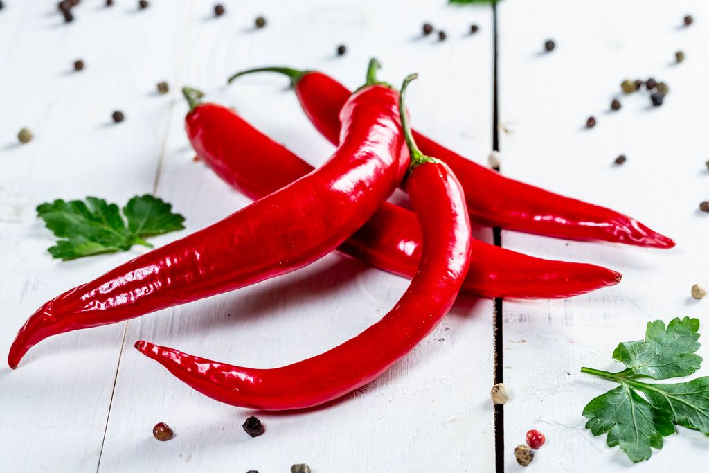 Red hot chili peppers on white wooden background (Flip 2019) (Flip 2019) Flip 2019