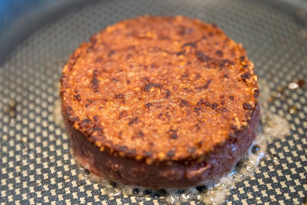 Roasted meatless burger from Beyond Meat, in a pan - a gluten-free lunch for a vegan diet