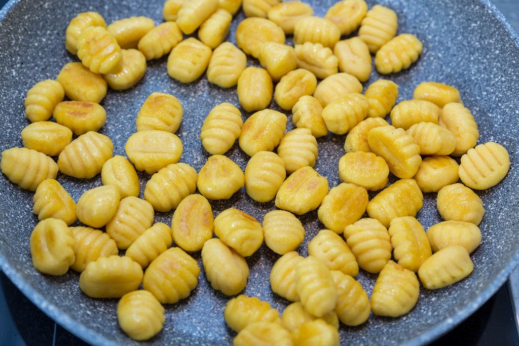 Roasting gnocchi gently in a frying pan
