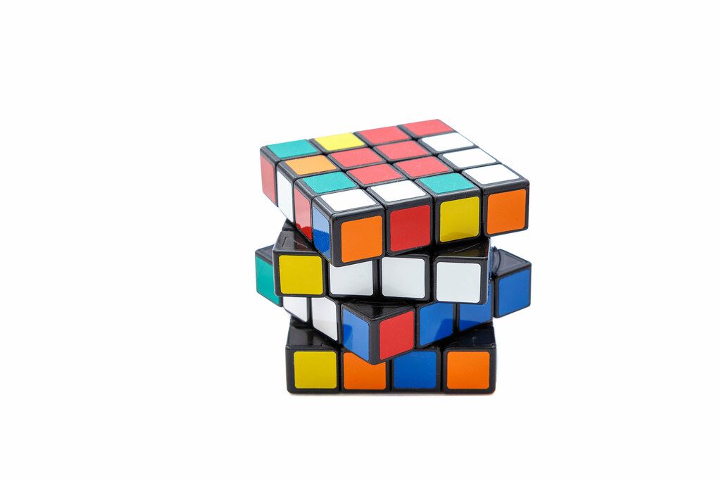 Rubik's cube 4x4x4 on white background with offset edges