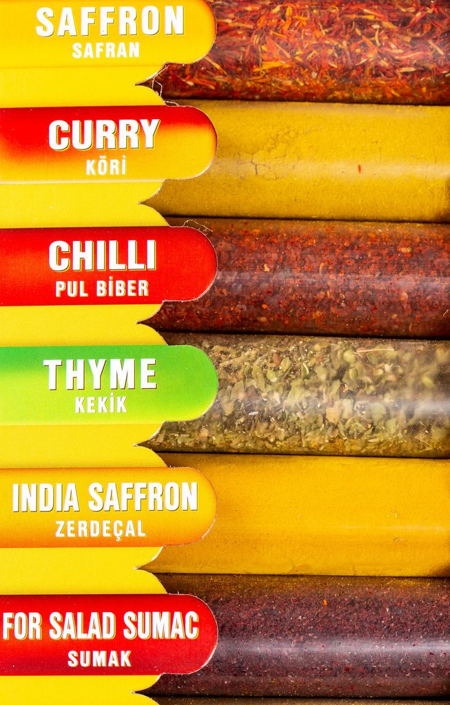 Saffron, curry, chili, thyme in transparent packages