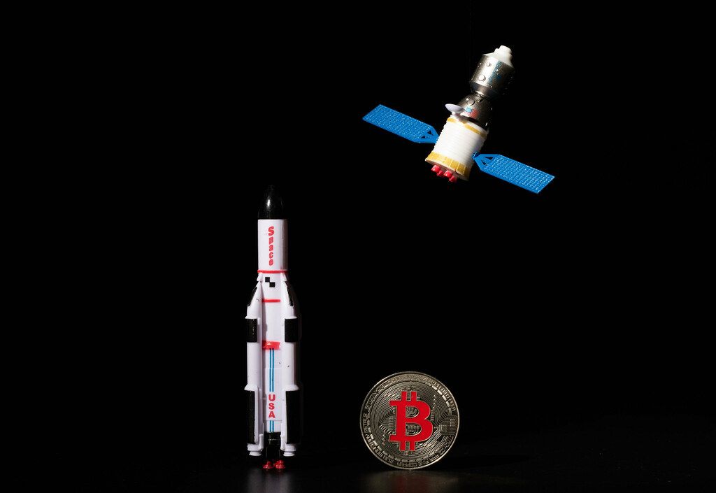 Satellite and space ship on black background