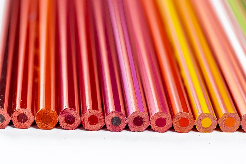 Set of colored pencils of different shades of yellow, red and brown