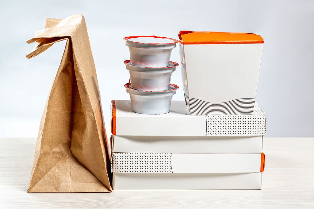 Set of Packed in paper containers and boxes of Chinese food. Home food delivery concept