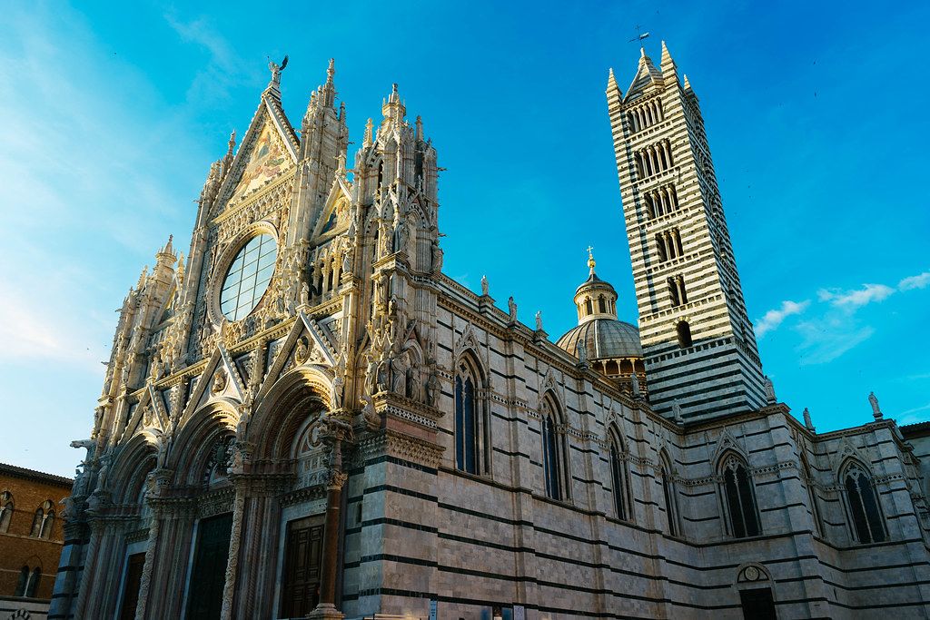 Siena Cathedral Duomo di Siena on a beautiful sunny day with blue sky in Siena, Italy