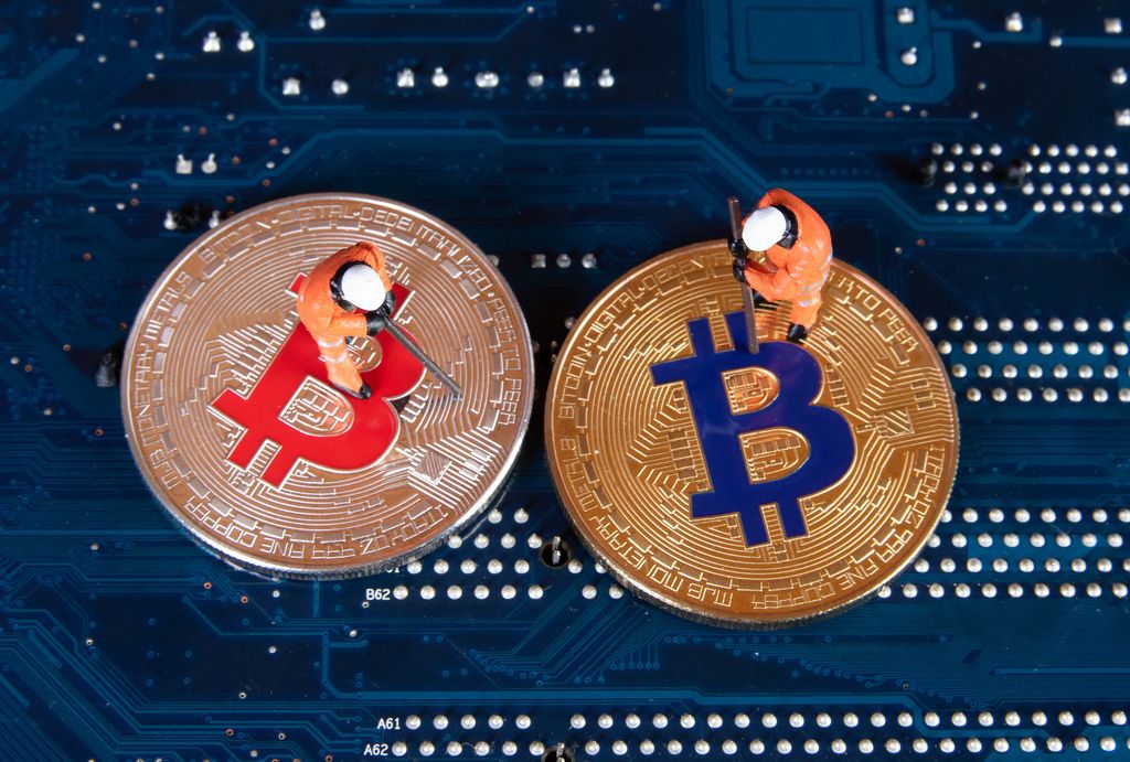 Silver and Golden Bitcoin with two miners