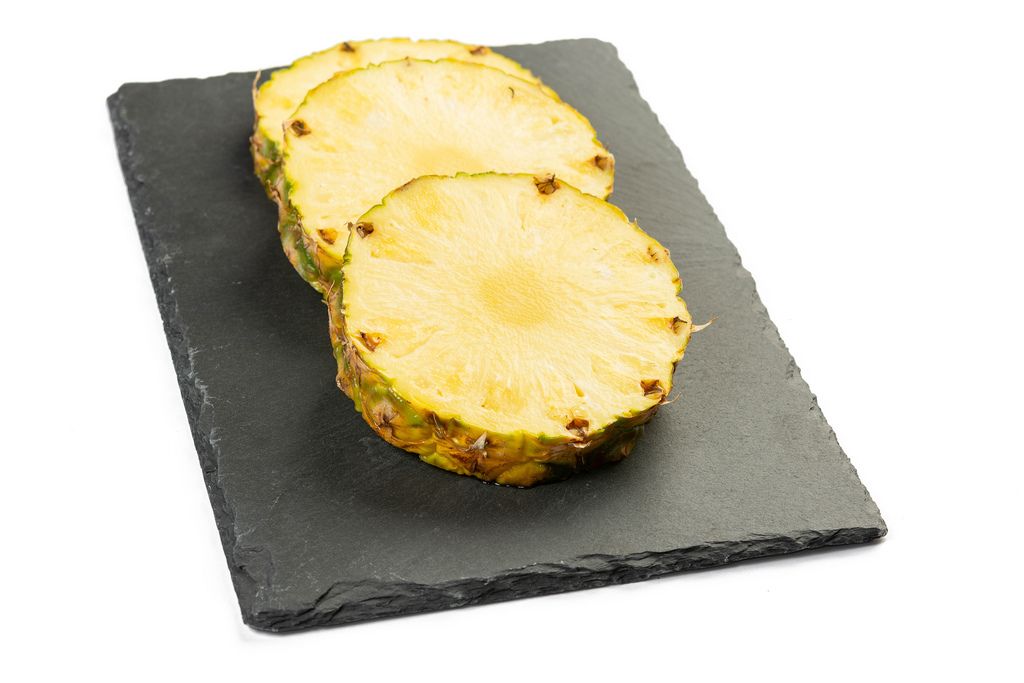 Sliced Pineapple on the black tray