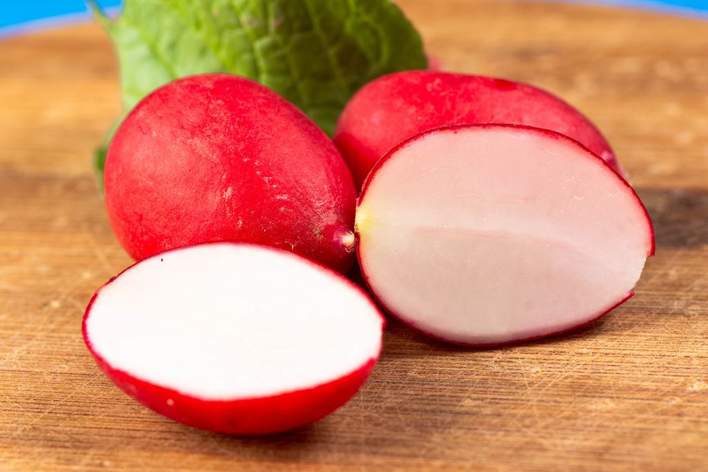 Sliced Red Radishes on the wooden board (Flip 2019)