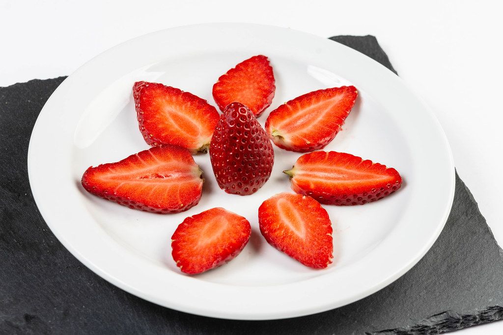 Sliced Strawberries served on the plate
