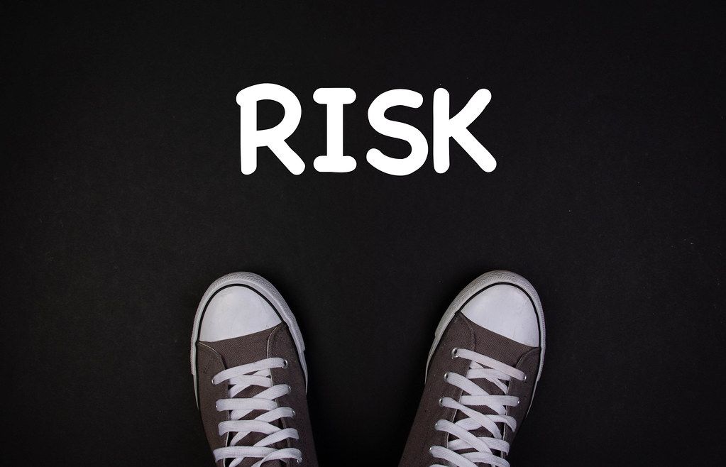 Sneaker shoes with risk text