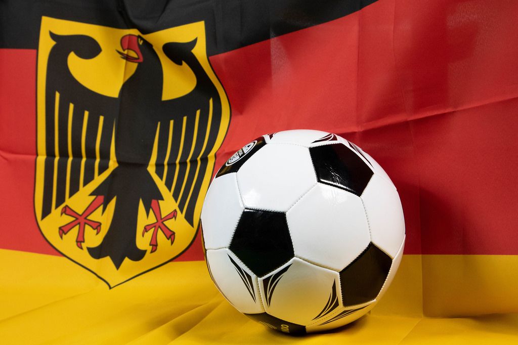 Soccer ball with Germany flag in background