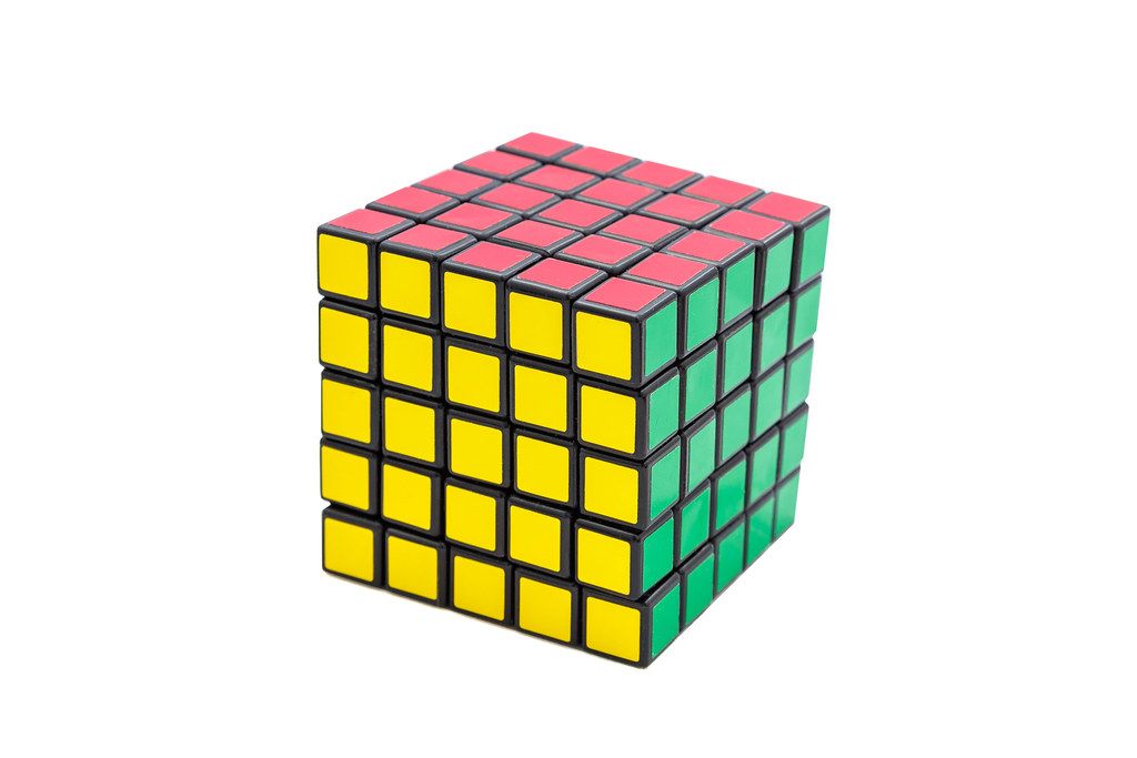 Solved Rubik's cube 5x5x5 on white background with green, yellow and red sides (Flip 2019)