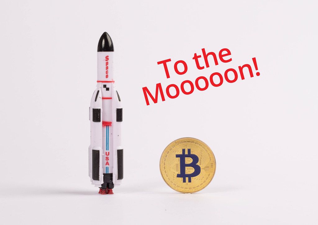 Space rocket with golden Bitcoin
