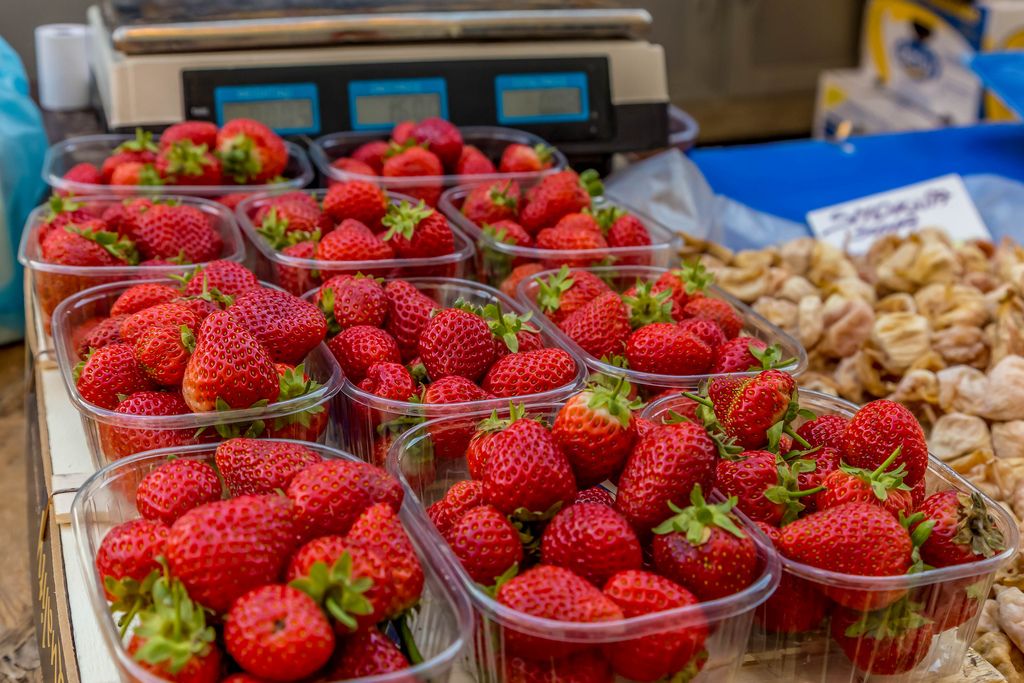 Strawberries and dried figs on marketplace