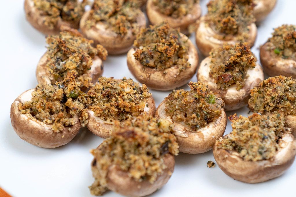 Stuffed Mushrooms with Cheese and Parsley on the plate