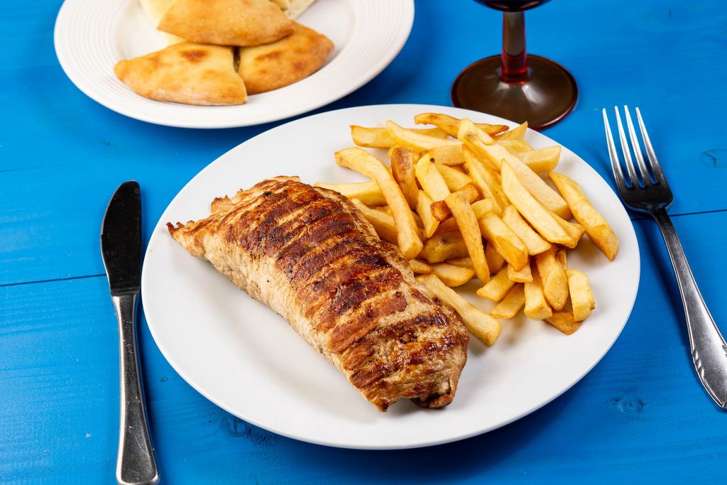 Stuffed pork Steak meat and French Fries on wooden table (Flip 2019)