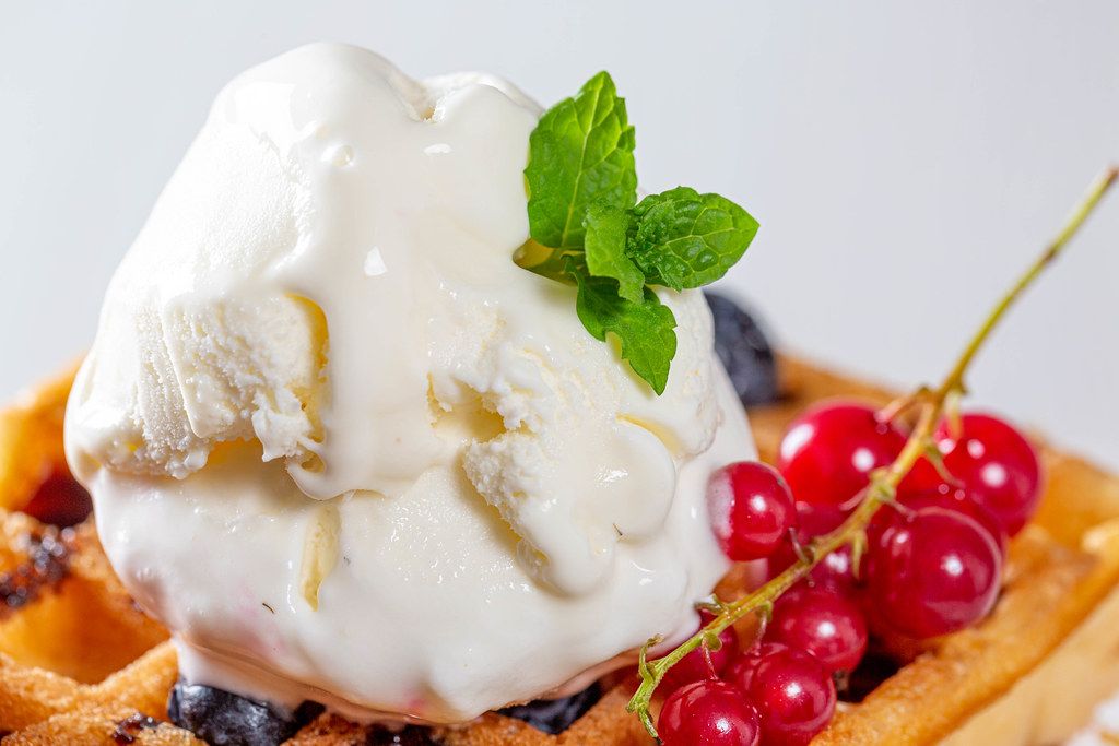 Sweet homemade berry belgian waffle with ice cream