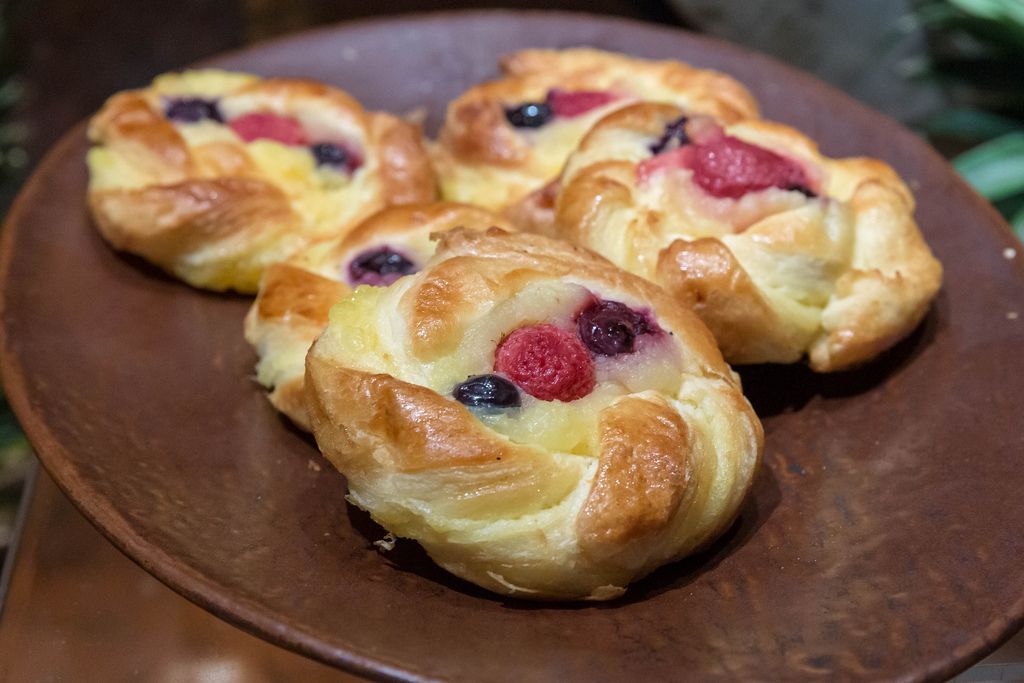Sweet pastries with cherry, blueberry and raspberry