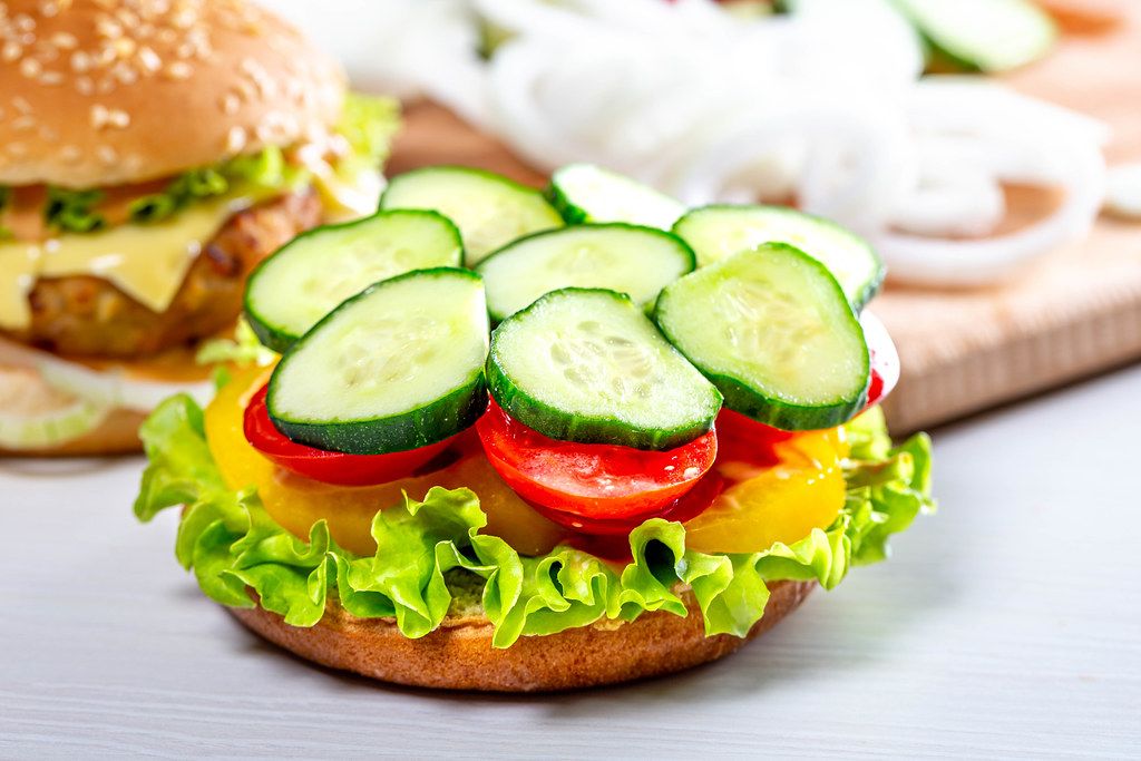 The process of cooking vegan Burger. Vegetable food concept (Flip 2019)