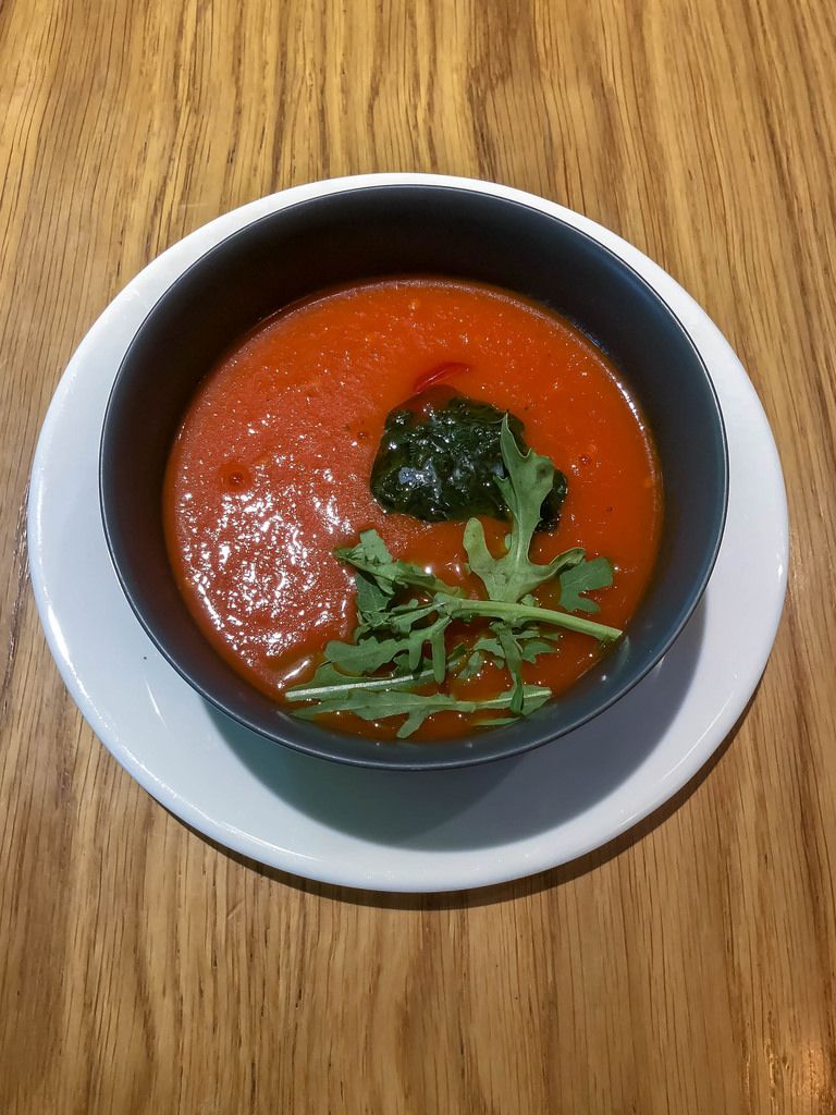 Tomato soup at Avocado Cafe: tomatoes, cherry tomatoes, carrots, onions, garlic, arugula, spices, basil sauce, provencal herbs