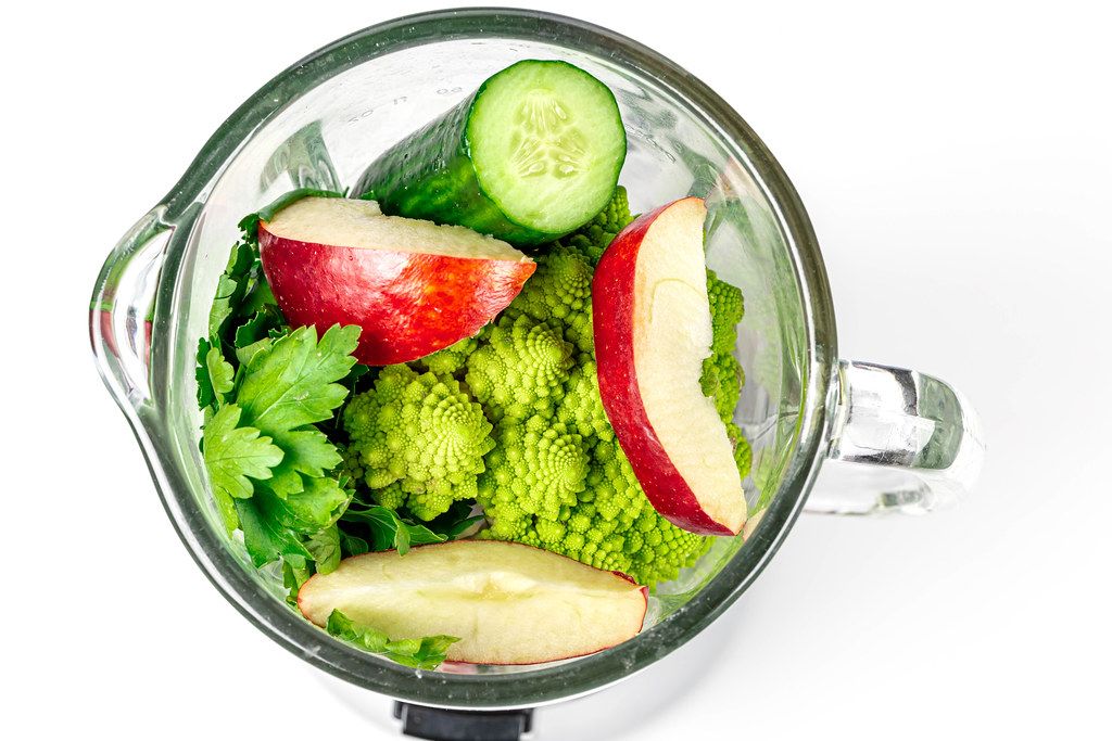 Top view , blender with fresh vegetables and fruit. The concept of cooking healthy food