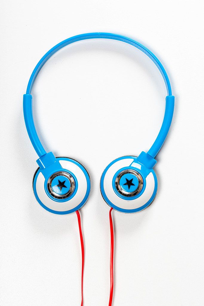 Top view children's blue headphones on white background (Flip 2019)