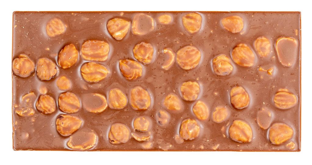 Top-view-milk-chocolate-bar-with-whole-hazelnut-nuts.jpg