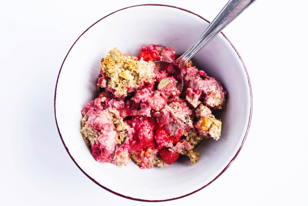Top view of healthy breakfast strawberry baked oatmeal in a bowl