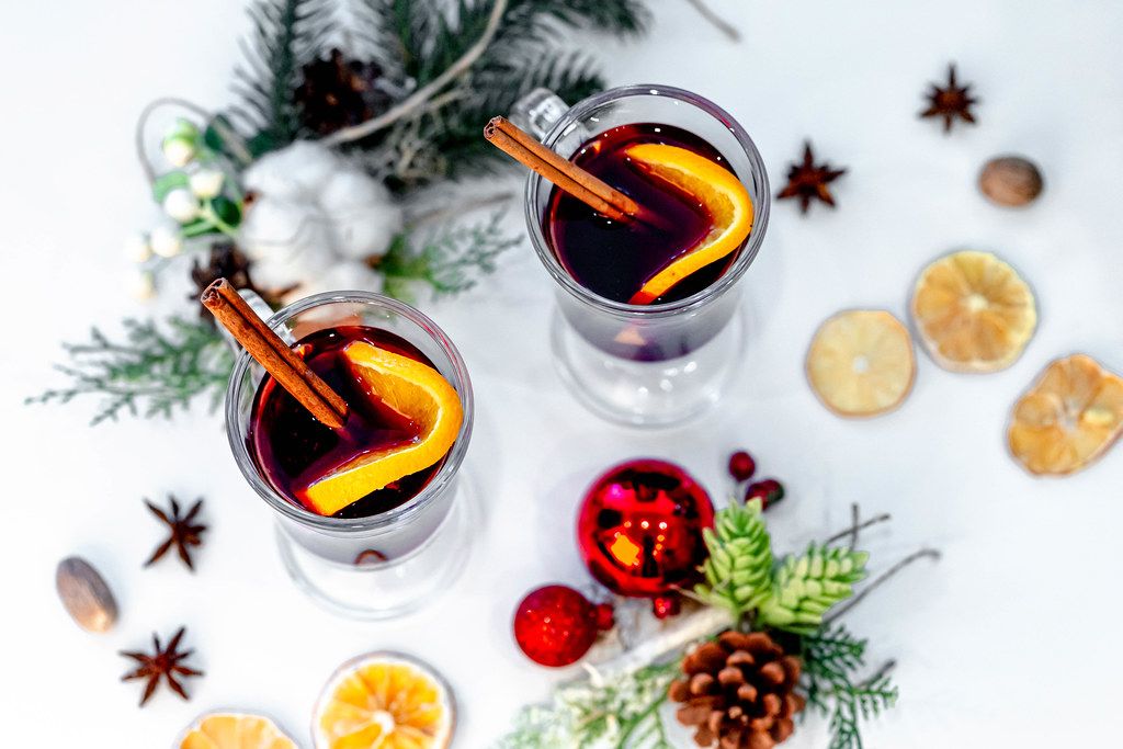 Top view of two glasses of mulled wine with christmas decor on a white background (Flip 2019)