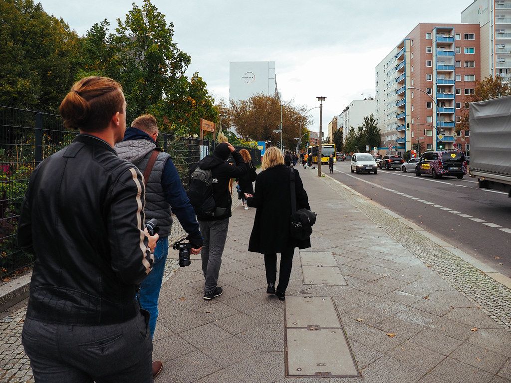 Tourists and photographers walking with cameras on the streets of Berlin