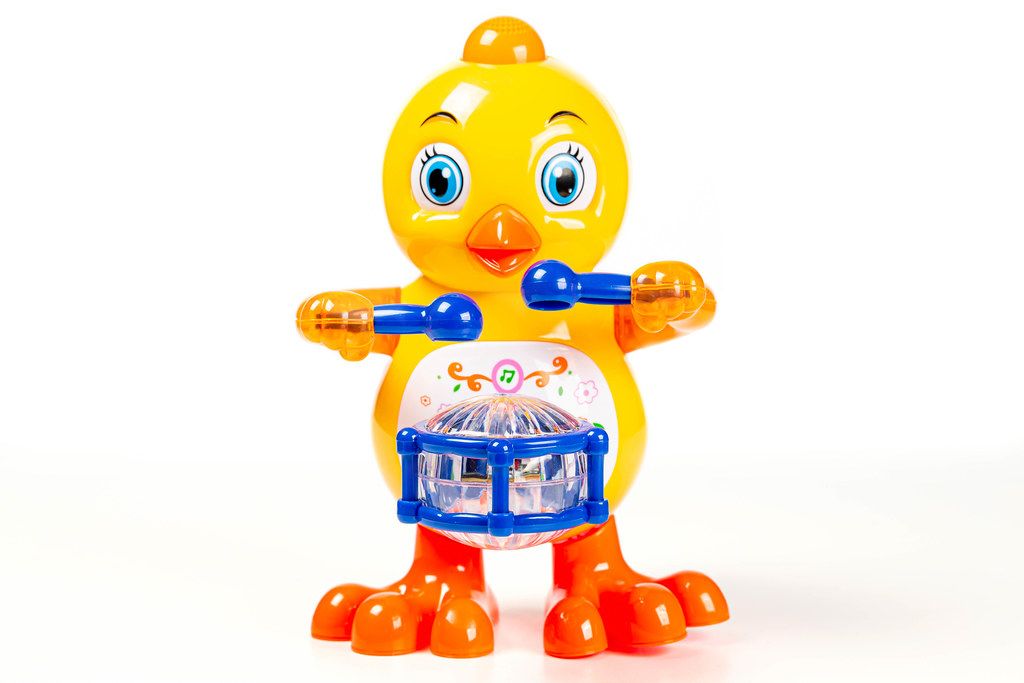 Toy-yellow-chicken-with-a-drum-on-a-white-background.jpg