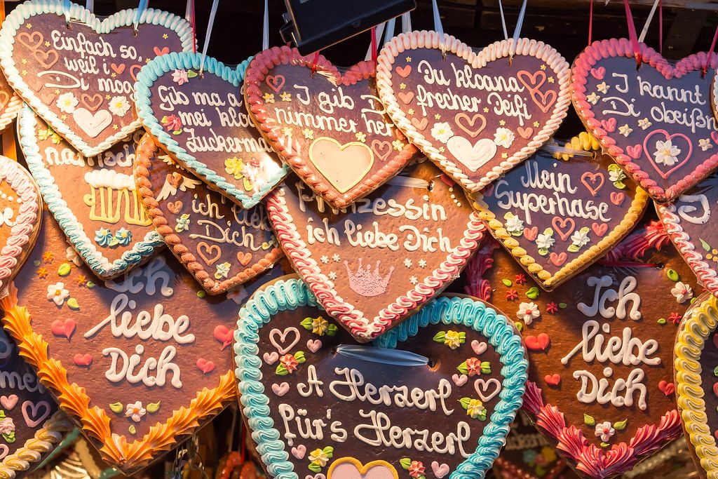 Traditional German heart-shaped gingerbread decorations for sale at Oktoberfest