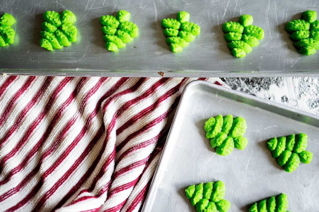 Tree shaped cookies in baking sheets