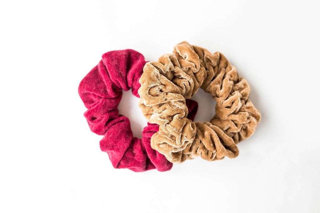 Two velvet scrunchies on white background top view (Flip 2019)