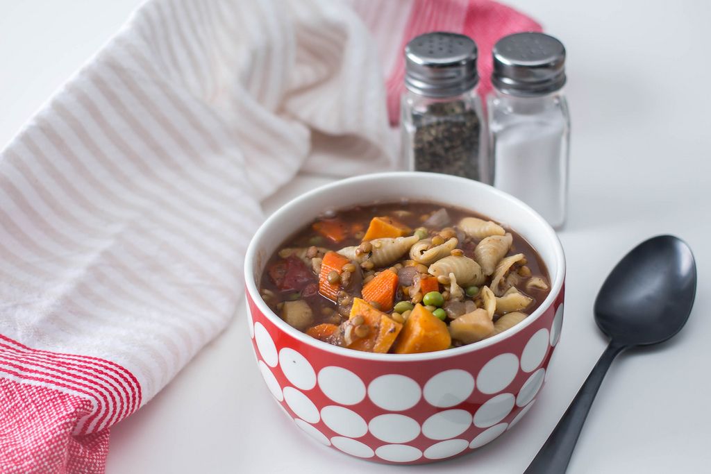 Vegetable Soup With Pasta and Lentil On a white Background