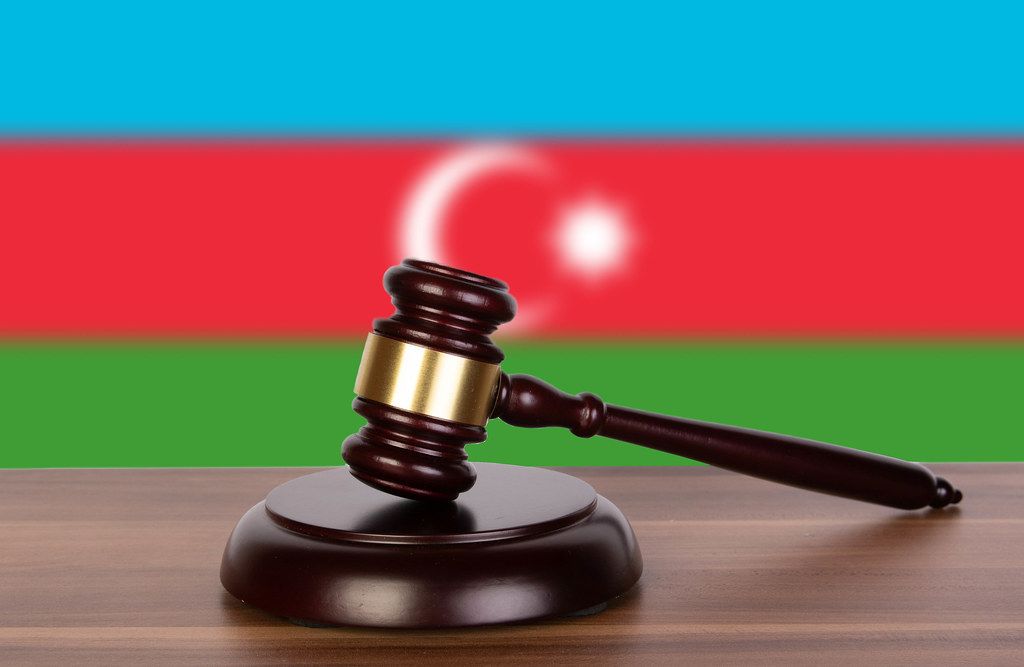 Wooden gavel and flag of Azerbaijan