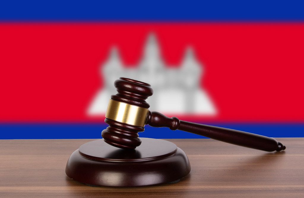 Wooden gavel and flag of Cambodia