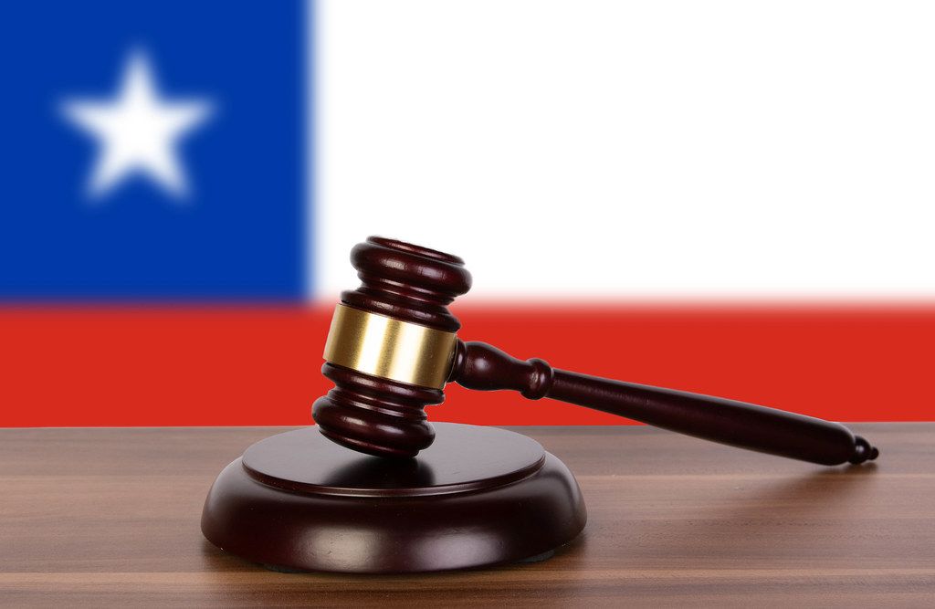 Wooden gavel and flag of Chile